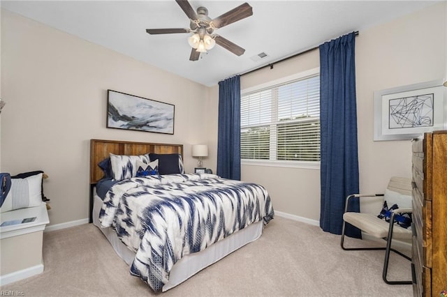 bedroom with baseboards, a ceiling fan, carpet, and visible vents