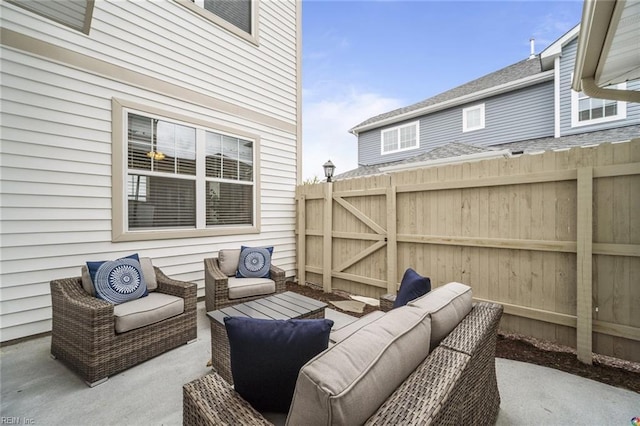 view of patio / terrace featuring fence and an outdoor hangout area