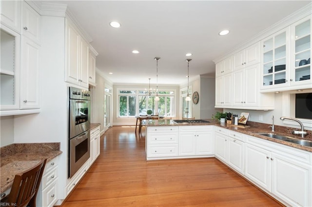 1263 Murphys Mill Rd, Suffolk, VA 23434 - kitchen with a peninsula, white cabinetry, a sink, and stainless steel appliances
