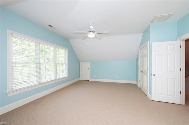 1263 Murphys Mill Rd, Suffolk, VA 23434 - additional living space with visible vents, a ceiling fan, lofted ceiling, and light colored carpet