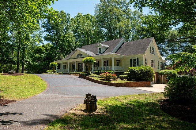 1263 Murphys Mill Rd, Suffolk, VA 23434 - view of front of property with a porch, a front lawn, and aphalt driveway