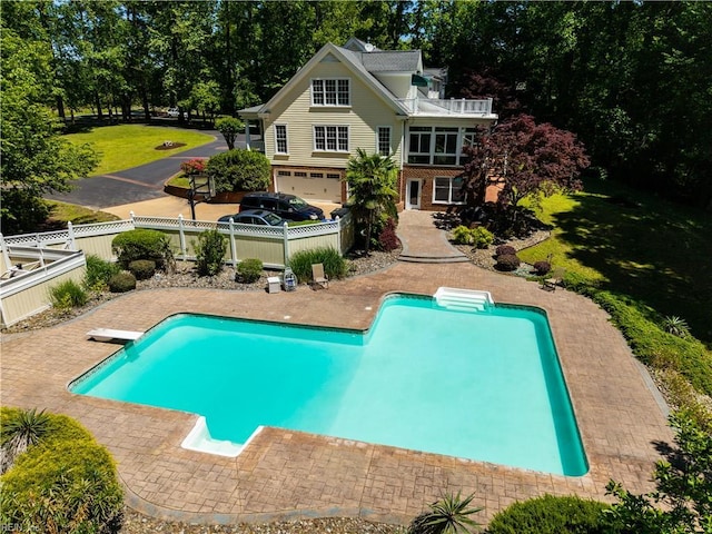 1263 Murphys Mill Rd, Suffolk, VA 23434 - view of swimming pool featuring a fenced backyard, a fenced in pool, a diving board, and a lawn