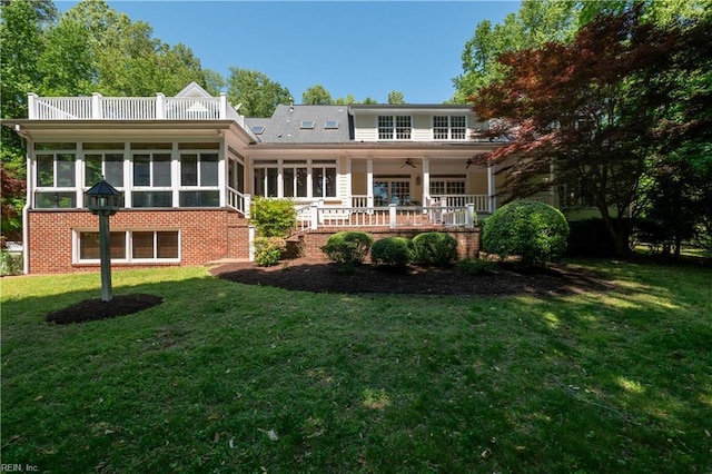1263 Murphys Mill Rd, Suffolk, VA 23434 - back of property featuring a lawn, a ceiling fan, and a sunroom