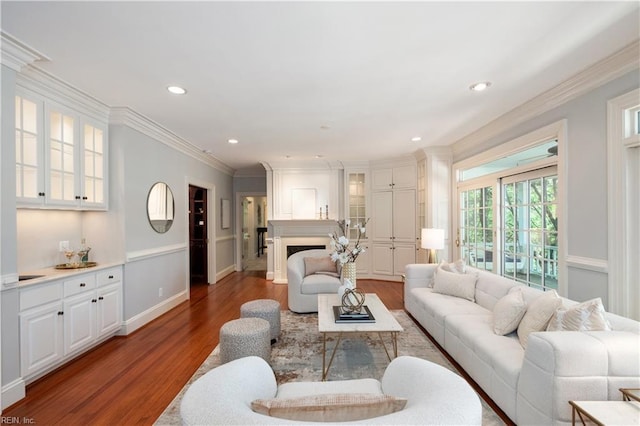 1263 Murphys Mill Rd, Suffolk, VA 23434 - living room with crown molding, wood finished floors, a fireplace, baseboards, and recessed lighting