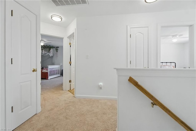 1728 Eleni Ct, Virginia Beach, VA 23453 - hallway featuring light colored carpet, radiator, baseboards, an upstairs landing, and visible vents
