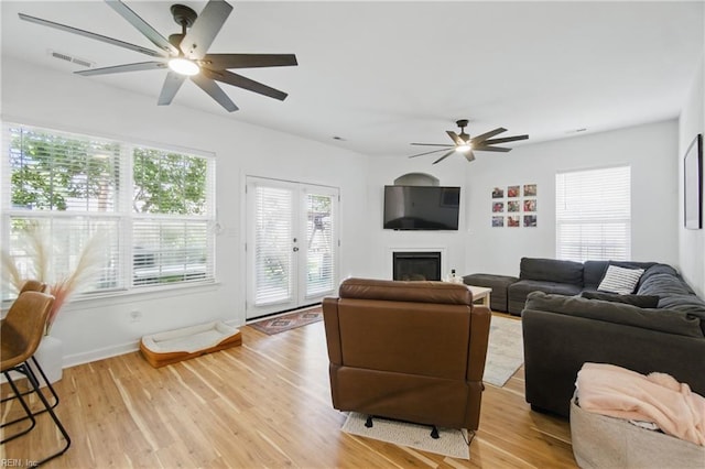 1728 Eleni Ct, Virginia Beach, VA 23453 - living room with visible vents, a ceiling fan, a fireplace, and light wood-type flooring