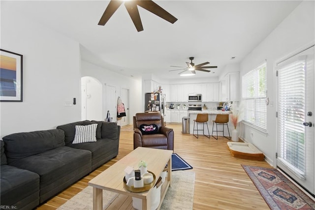 1728 Eleni Ct, Virginia Beach, VA 23453 - living area featuring arched walkways, ceiling fan, and light wood finished floors