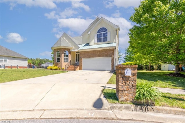 traditional-style home with brick siding, a garage, a front lawn, and driveway