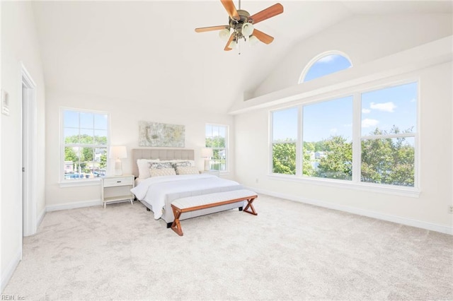 bedroom featuring carpet flooring, baseboards, and multiple windows
