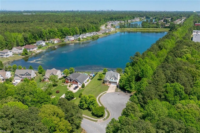 birds eye view of property with a residential view, a water view, and a forest view