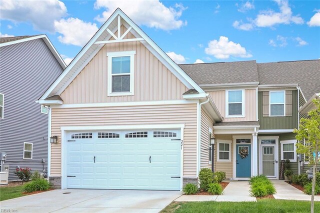 221 Kenny Ln, Smithfield, VA 23430 - craftsman inspired home featuring roof with shingles, stone siding, a garage, board and batten siding, and concrete driveway