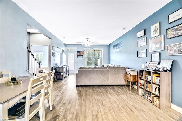 221 Kenny Ln, Smithfield, VA 23430 - living area with a ceiling fan, visible vents, wood finished floors, stairway, and baseboards