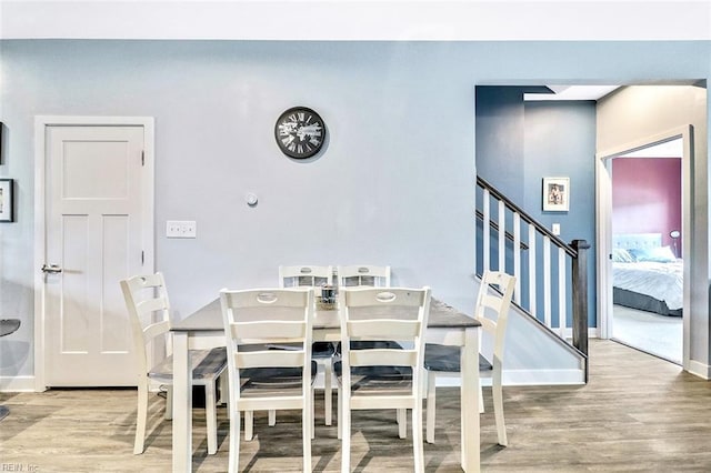 221 Kenny Ln, Smithfield, VA 23430 - dining area with baseboards, wood finished floors, and stairway