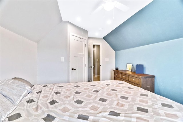 bedroom with a ceiling fan and vaulted ceiling