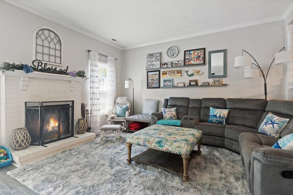 4805 Marlwood Way, Virginia Beach, VA 23462 - living room featuring ornamental molding, a fireplace, and wood finished floors