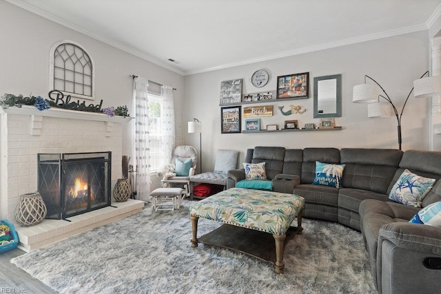 living room featuring ornamental molding, a fireplace, and wood finished floors