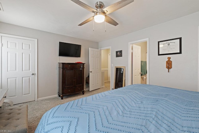 carpeted bedroom featuring baseboards and a ceiling fan