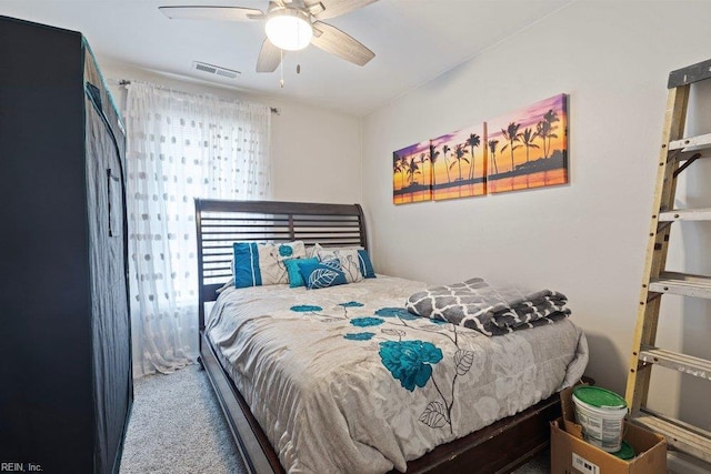 bedroom featuring carpet floors, a ceiling fan, and visible vents
