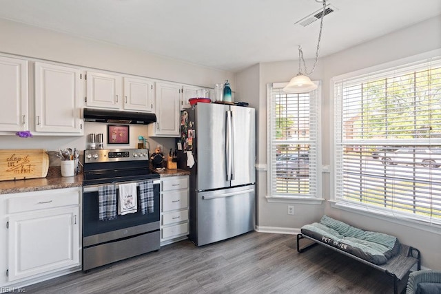 kitchen featuring under cabinet range hood, white cabinets, appliances with stainless steel finishes, and visible vents