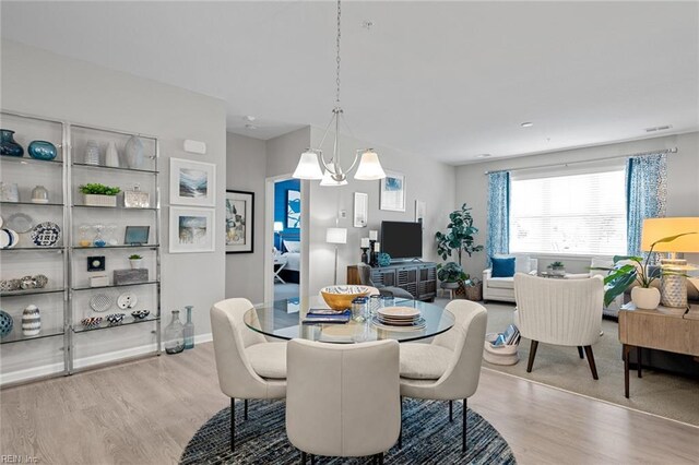 1728 Vankar Dr, Virginia Beach, VA 23456 - dining space featuring a notable chandelier, wood finished floors, and visible vents