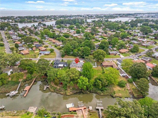 drone / aerial view featuring a water view and a residential view