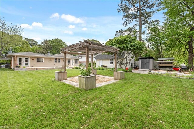 view of yard featuring a storage unit, an outdoor structure, french doors, and a pergola