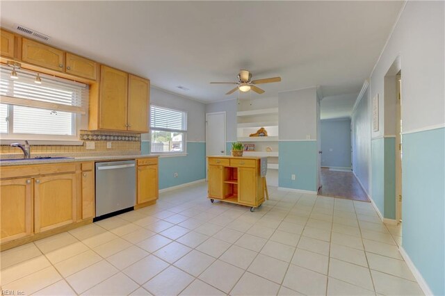 kitchen with stainless steel dishwasher, open shelves, visible vents, light countertops, and a sink