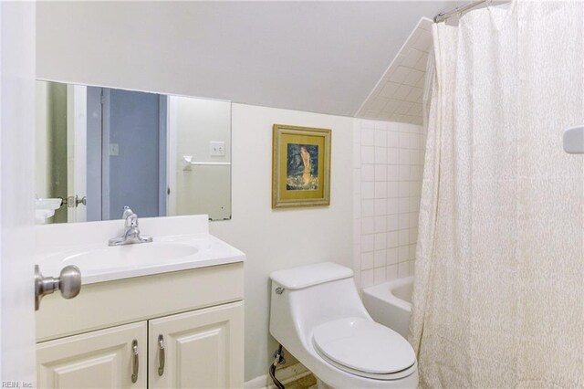 bathroom featuring vanity, toilet, and shower / tub combo