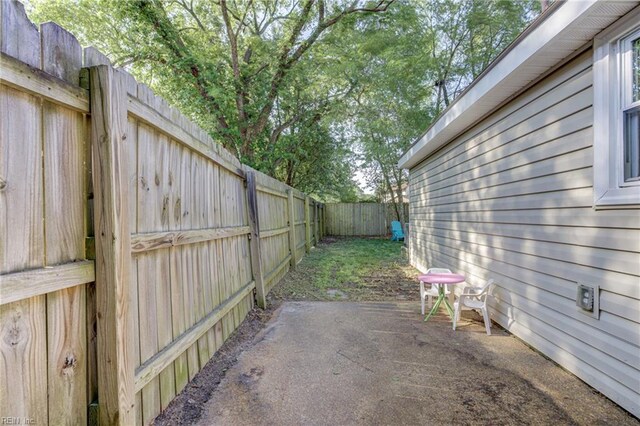 view of yard with a patio and a fenced backyard