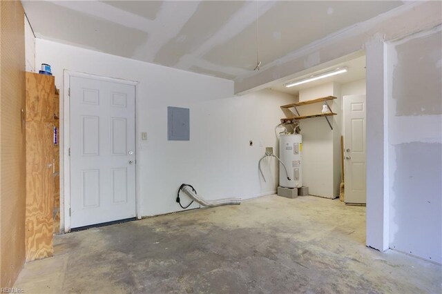 garage featuring electric panel and electric water heater