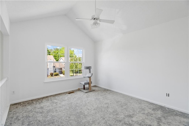 unfurnished room featuring carpet flooring, ceiling fan, baseboards, lofted ceiling, and visible vents