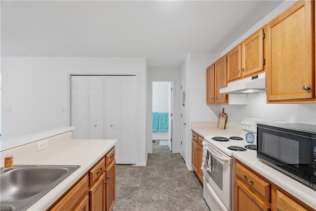 kitchen featuring black microwave, a sink, light countertops, electric stove, and under cabinet range hood