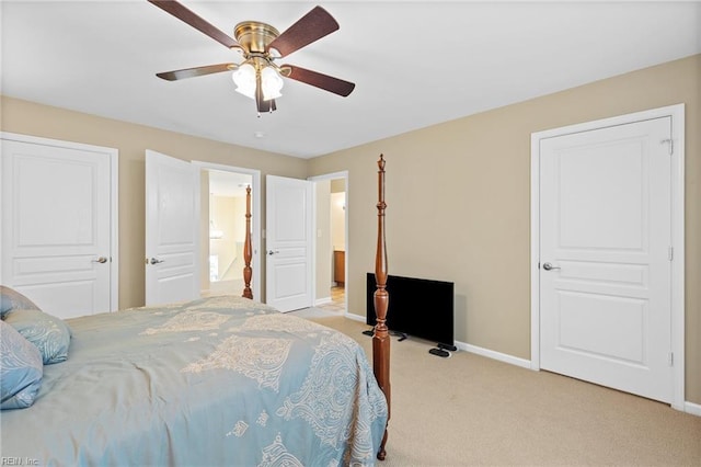 bedroom with light colored carpet, baseboards, and ceiling fan