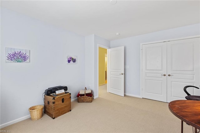 interior space featuring carpet floors and baseboards