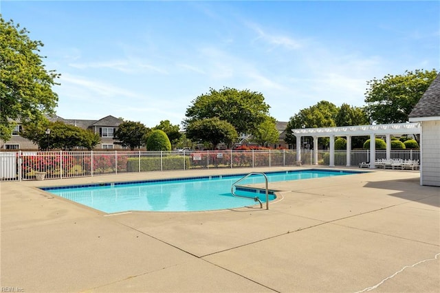 pool with fence and a patio