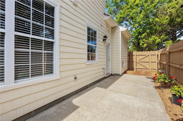 view of patio featuring fence