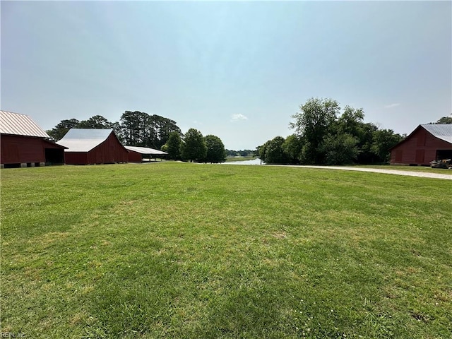 109 Willow Wood Ave, Smithfield, VA 23430 - view of grassy yard featuring a water view, an outdoor structure, and a barn