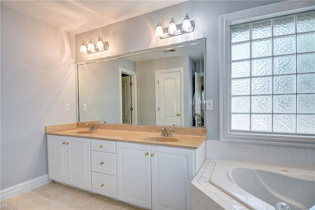 bathroom with a sink, tile patterned floors, and plenty of natural light