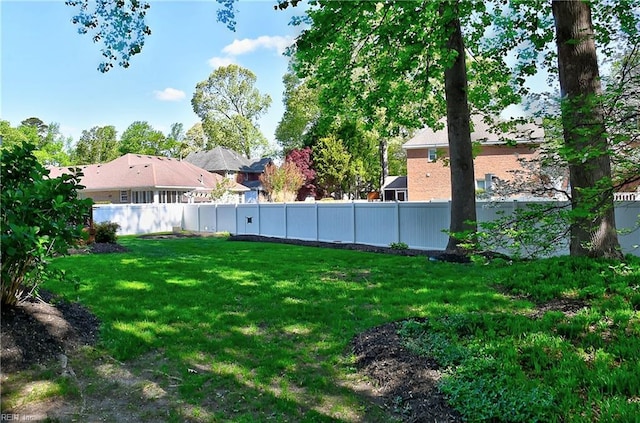 view of yard with a fenced backyard