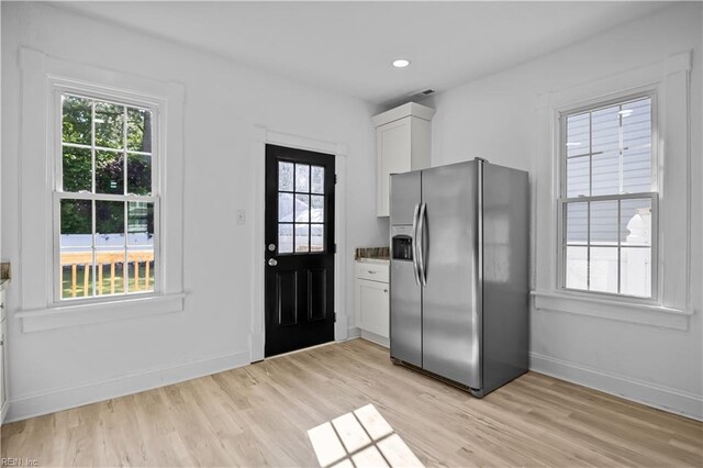 1125 Stewart St, Chesapeake, VA 23324 - kitchen with plenty of natural light, stainless steel refrigerator with ice dispenser, and light wood-style flooring