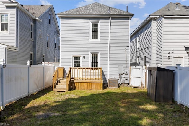 1125 Stewart St, Chesapeake, VA 23324 - rear view of property with a fenced backyard, a wooden deck, a yard, and cooling unit