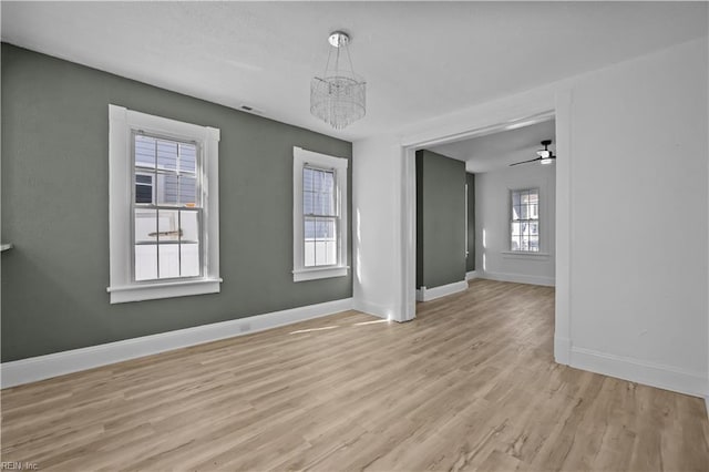 1125 Stewart St, Chesapeake, VA 23324 - unfurnished dining area with baseboards, a chandelier, light wood-style flooring, and visible vents