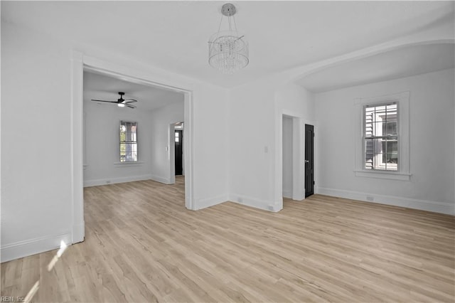 1125 Stewart St, Chesapeake, VA 23324 - interior space featuring arched walkways, baseboards, an inviting chandelier, and light wood-type flooring