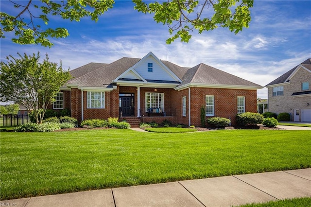 1829 Fury Way, Virginia Beach, VA 23456 - craftsman-style house with brick siding, a front lawn, and covered porch