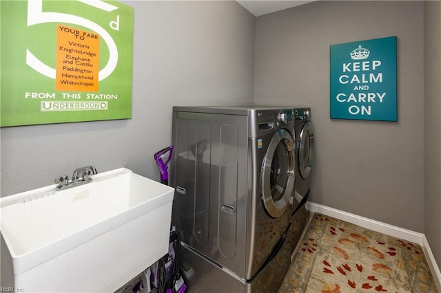 1829 Fury Way, Virginia Beach, VA 23456 - clothes washing area with a sink, baseboards, laundry area, and washing machine and clothes dryer