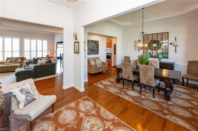 1829 Fury Way, Virginia Beach, VA 23456 - dining area featuring an inviting chandelier, baseboards, crown molding, and wood finished floors