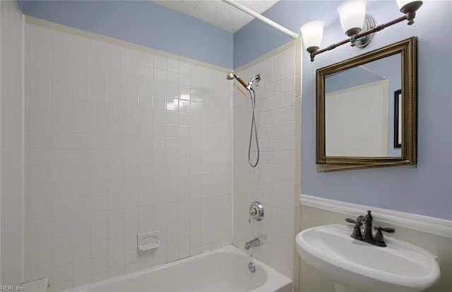 22 Mitchell Rd, Hampton, VA 23669 - bathroom featuring a textured ceiling, bathing tub / shower combination, and a sink