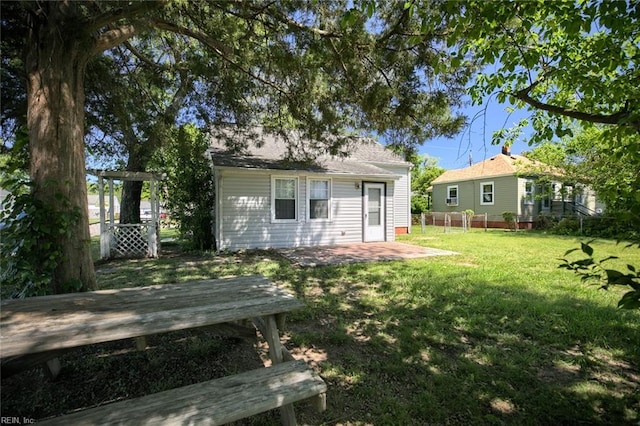 22 Mitchell Rd, Hampton, VA 23669 - rear view of property featuring a lawn, fence, and a wooden deck