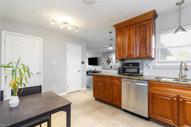 kitchen with stainless steel dishwasher, a sink, stone counters, and brown cabinets