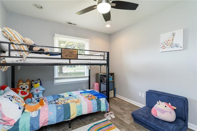 bedroom featuring wood finished floors, multiple windows, baseboards, recessed lighting, and ceiling fan